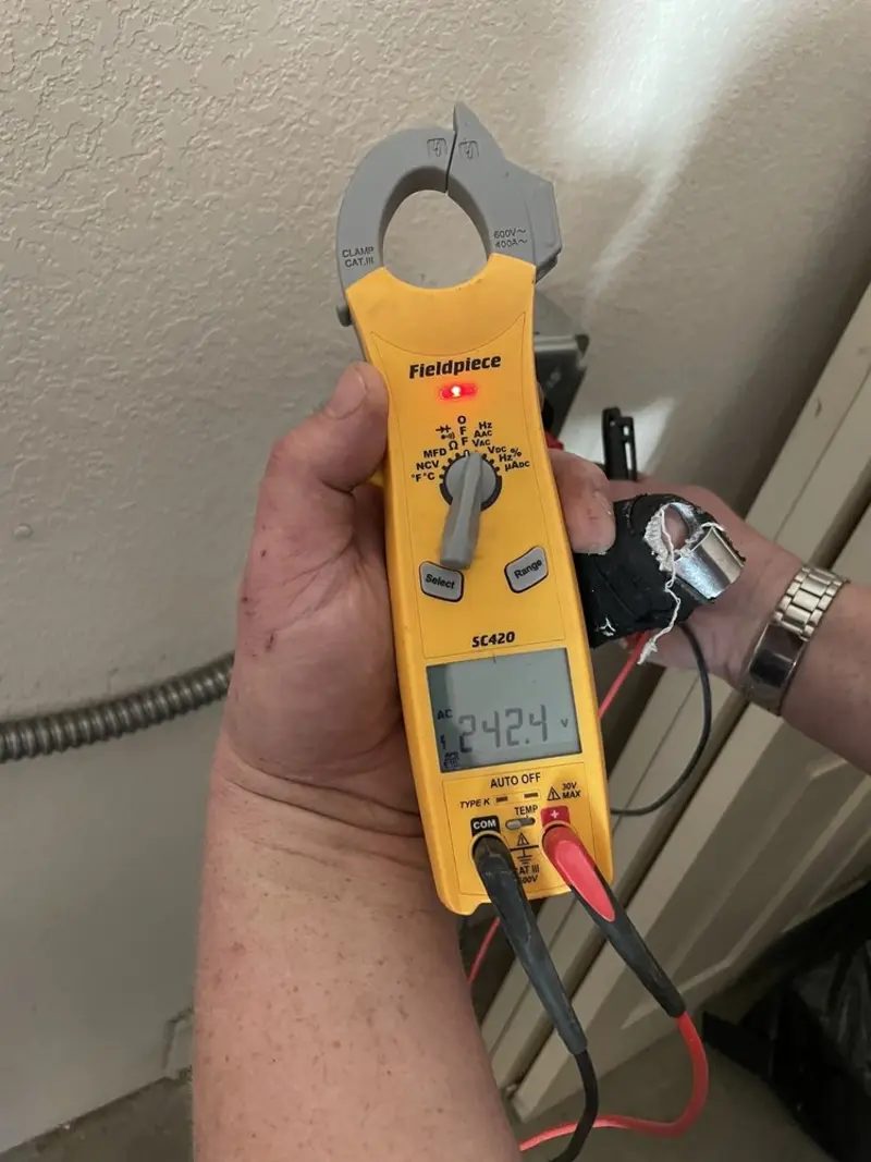 Voltage testing with clamp meter during Ceiling Fan Installation in Ray